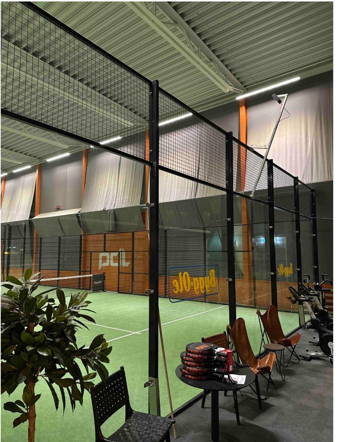 GAMETRAQ 6 AI padel camera mounted on a pole above the padel court fence